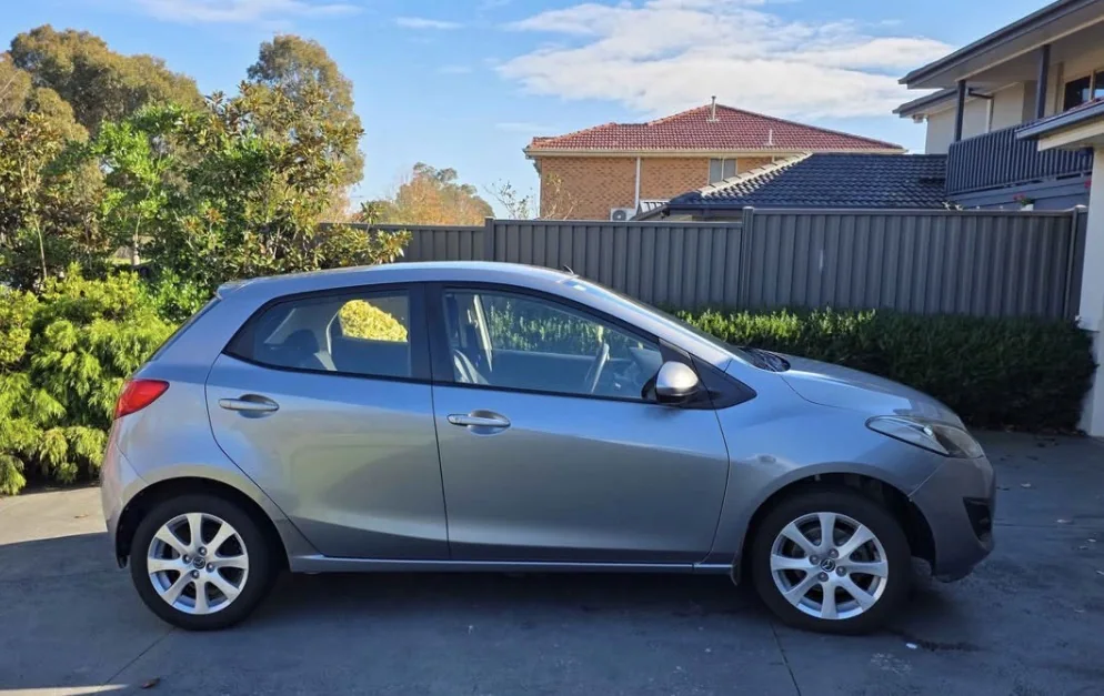Silver compact rental vehicle available through Domain Services CL
